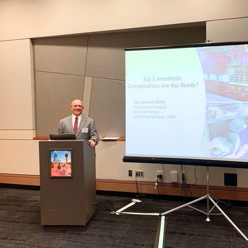 Dr. Tim Loonam speaking at an event