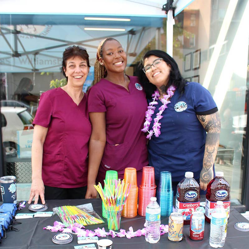 three veterinary team members at a booth