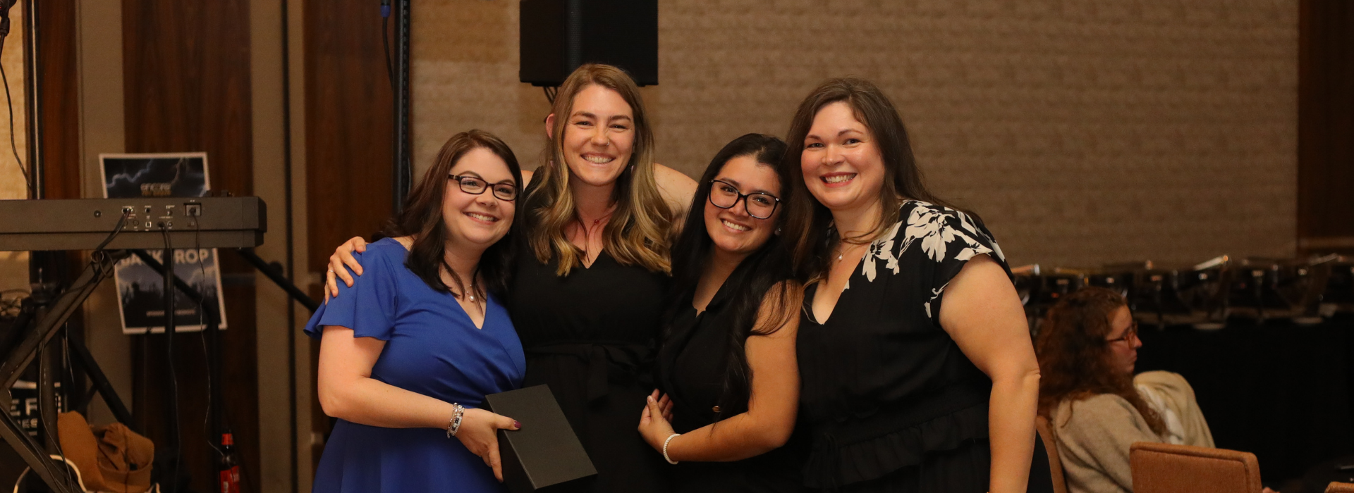 Image of practice leaders from Reynolda Veterinary Hospital accepting their award during Ovation 2025