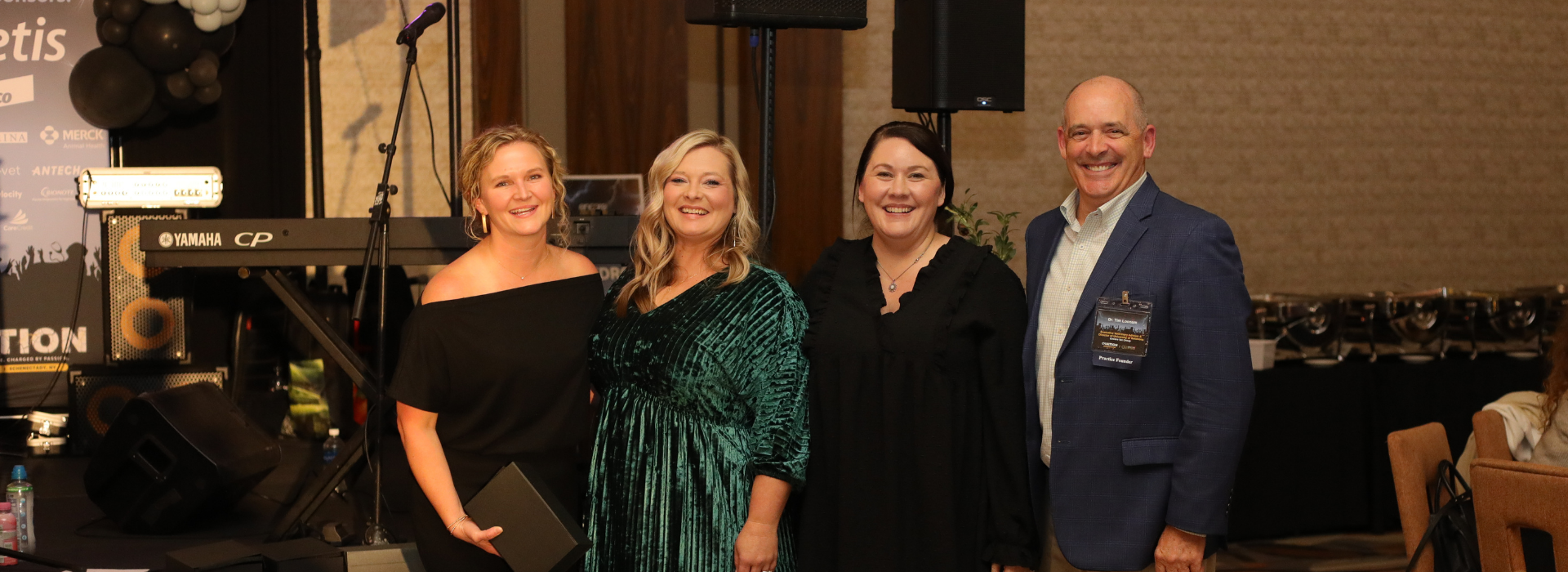 Image of leaders from Grace Animal Hospital accepting their award at Ovation 2025